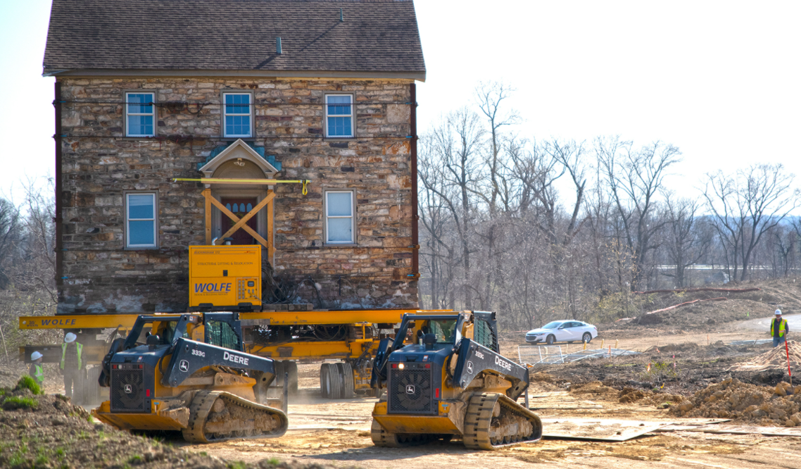 Harrisburg apartment for rent. Construction moving a house on the site of the reserve at river's' edge.